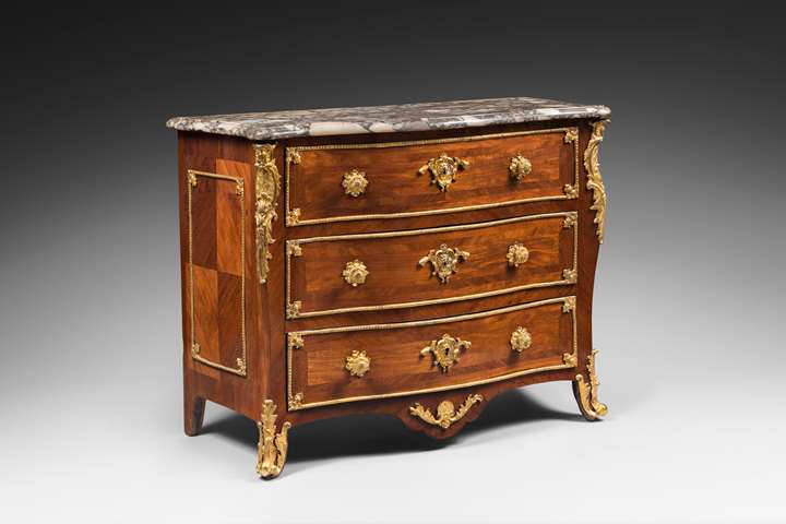 An ormolu-mounted amaranth marquetery commode